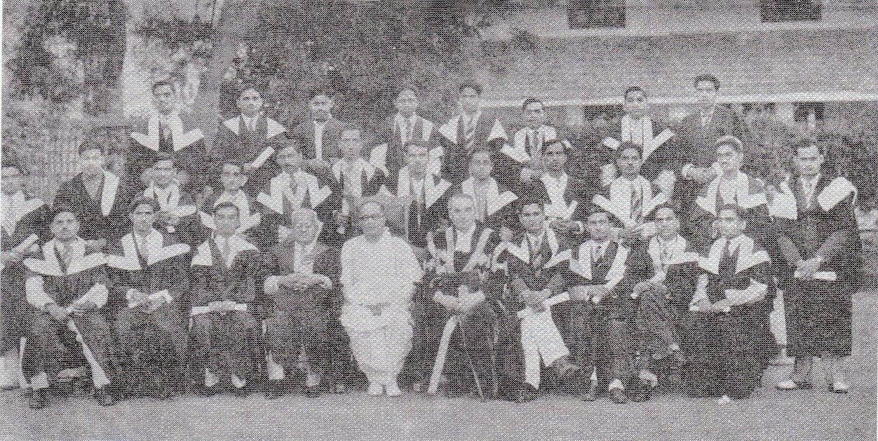 Graduates in gowns seated in rows for a group photograph at a 1942 university convocation